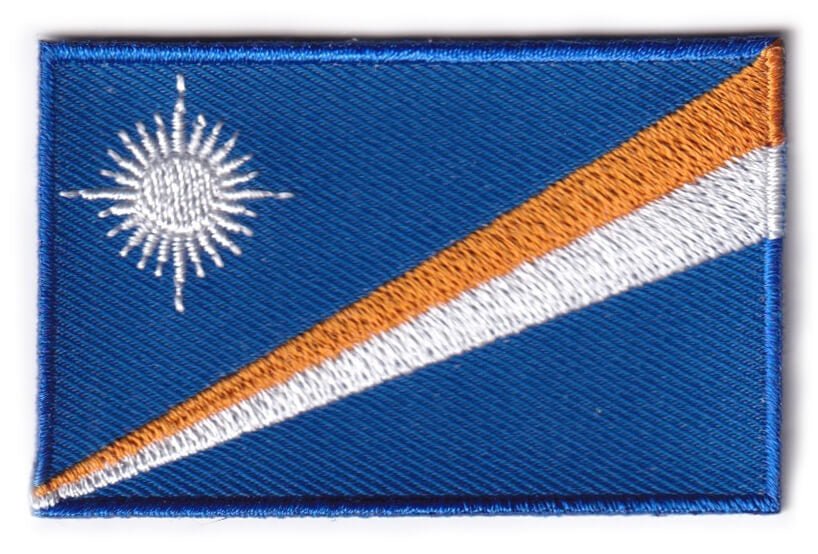 Marshall Islands flag patch, 6.5 x 4 cm, features blue with orange and white diagonal stripes and a white star.