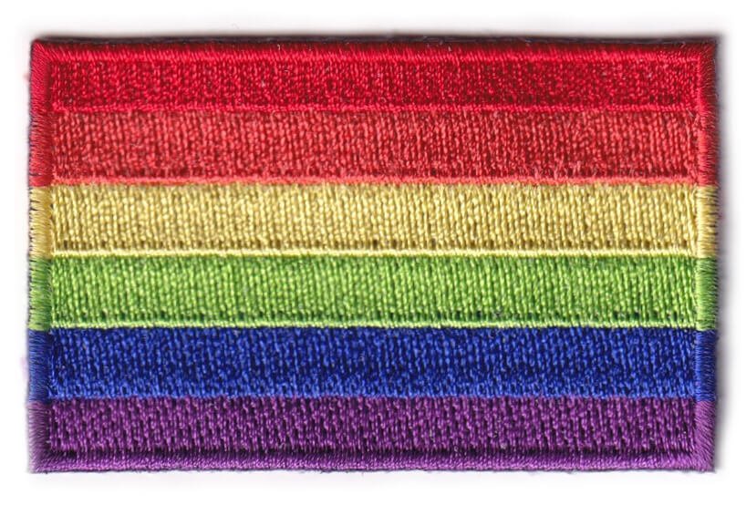 Rainbow flag patch with red, orange, yellow, green, blue, and purple stripes, symbolizing pride.