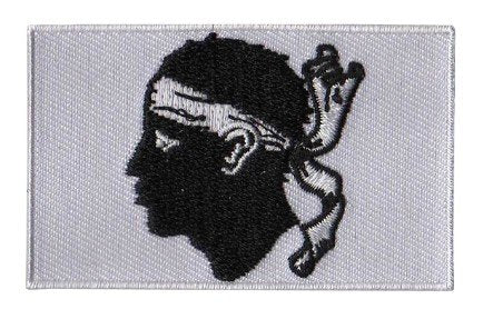 Corsica flag patch featuring a Moor's Head with white bandana on a white background, size 6.5 x 4 cm.