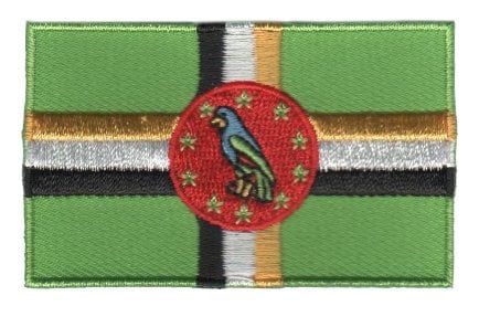 Dominica flag patch with green background, cross stripes, and central parrot motif.