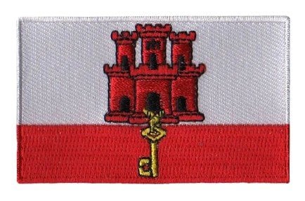 Gibraltar flag patch featuring red castle and gold key, 6.5 x 4 cm.