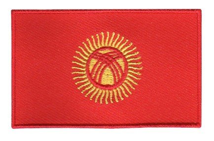 Kyrgyzstan flag patch with red background and yellow sun emblem featuring 40 rays and yurt symbol, size 6.5 x 4 cm.
