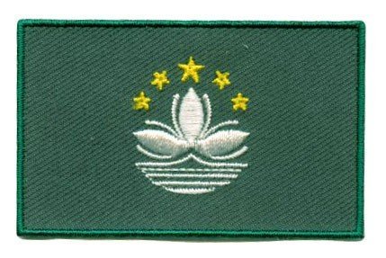 Macau flag patch with green base, white lotus, gold stars; 6.5 x 4 cm.
