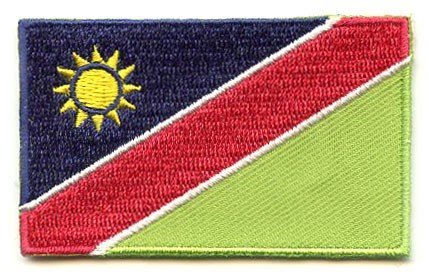 Namibia flag patch with blue, red, and green diagonal stripes, golden sun, and white borders, size 6.5 x 4 cm.