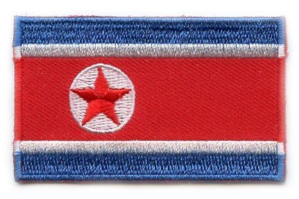 North Korea flag patch, 6.5 x 4 cm, red background with blue and white stripes, white circle with red star.