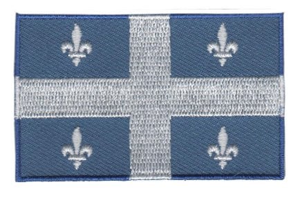 Quebec flag patch with white cross and fleurs-de-lis on blue background, size 6.5 x 4 cm.