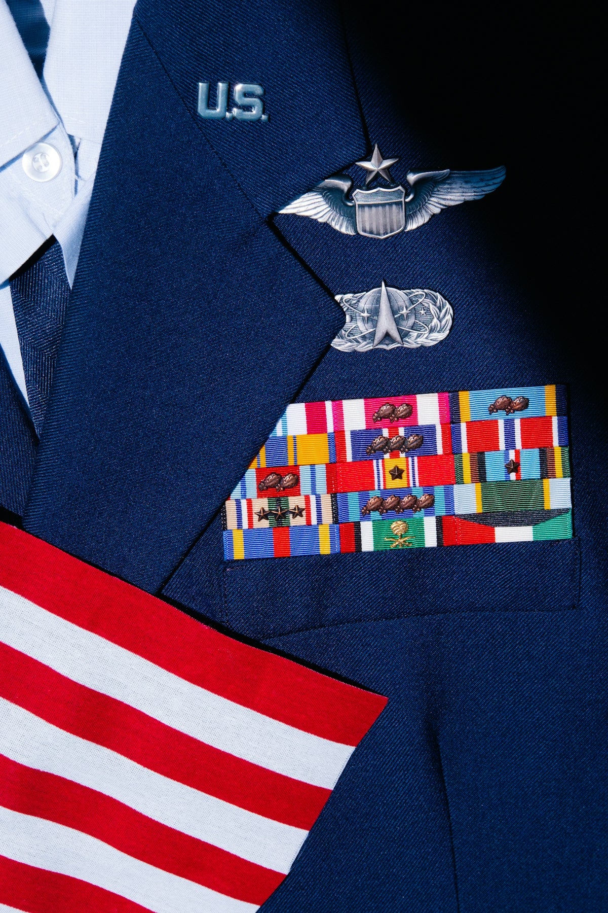 a close up of a uniform with a flag