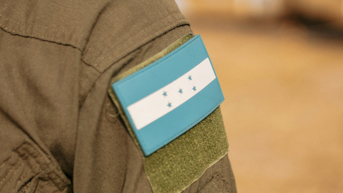 a close up of a uniform with a flag on it